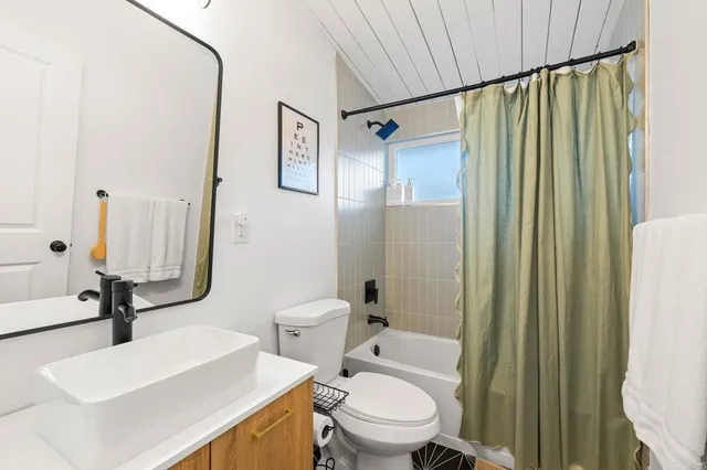 a bedroom with a bed and a lamp