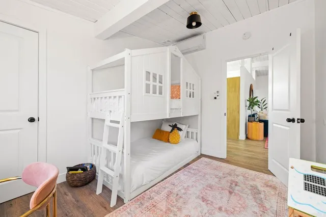 a bedroom with bed and window