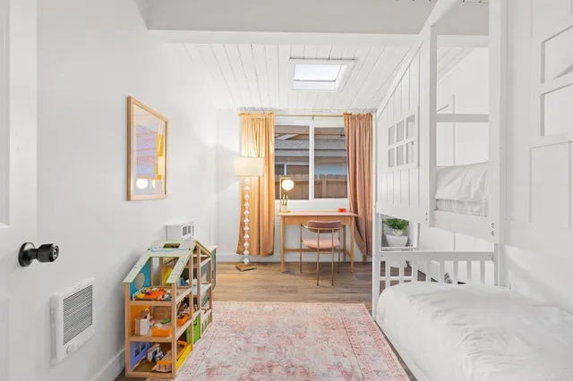 a view of a patio with a table and chairs