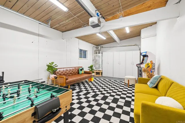 a view of a swimming pool and outdoor seating