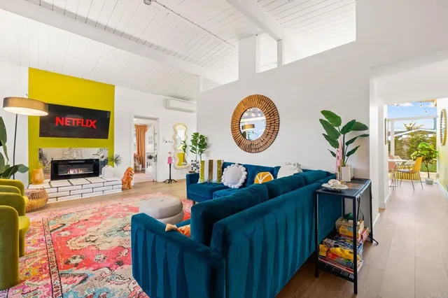 a living room filled with furniture and a rug