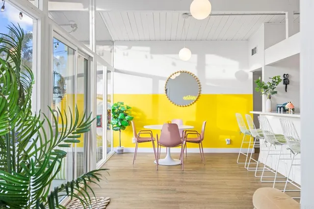 a view of a swimming pool with furniture