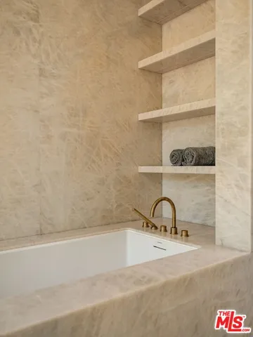 a view of swimming pool with a table and chairs