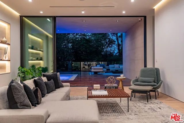 a view of living room with furniture and wooden floor