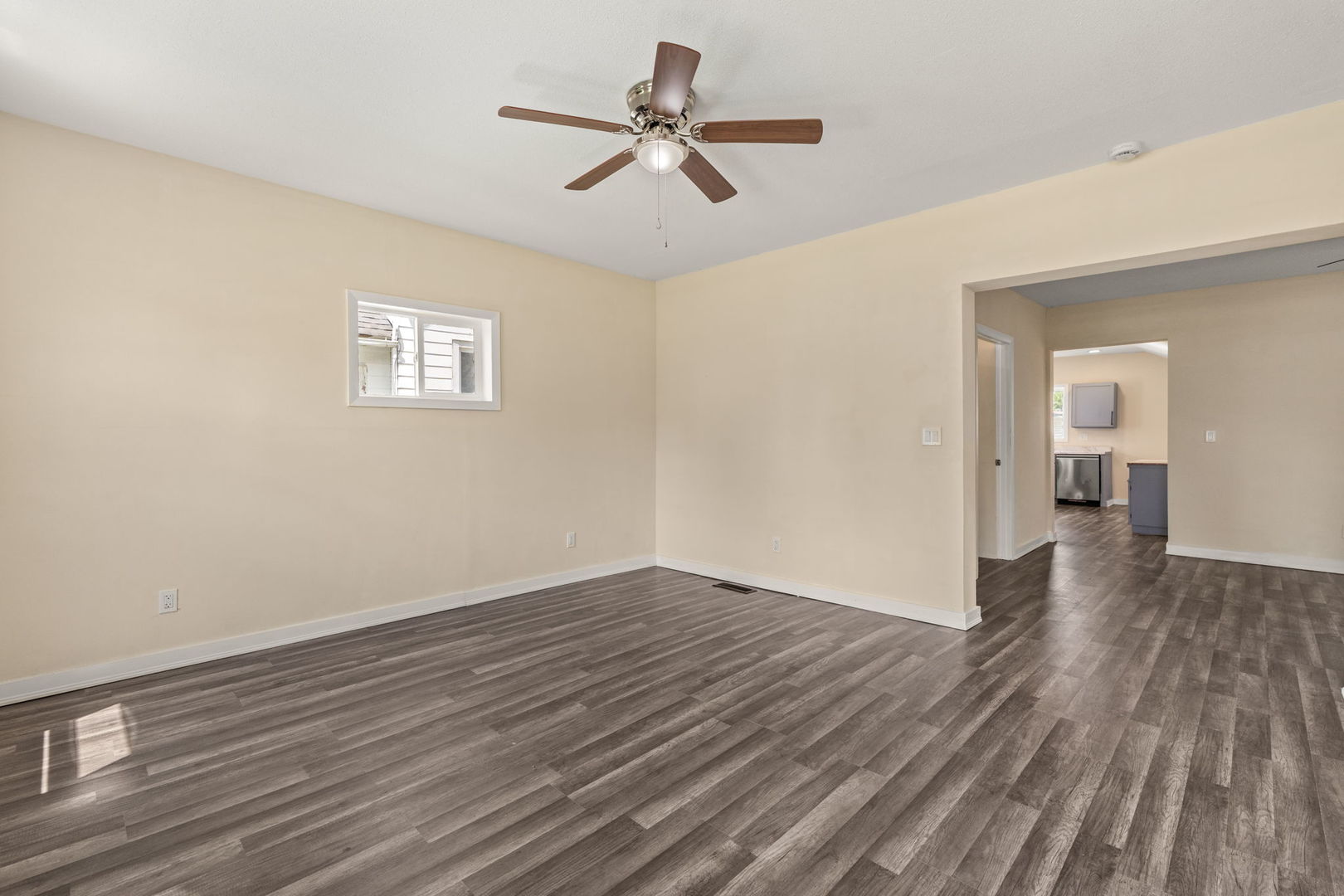 548 7th Avenue South Clinton, IA 52732 - Photo 2 of 23 wooden floor in an empty room with a window
