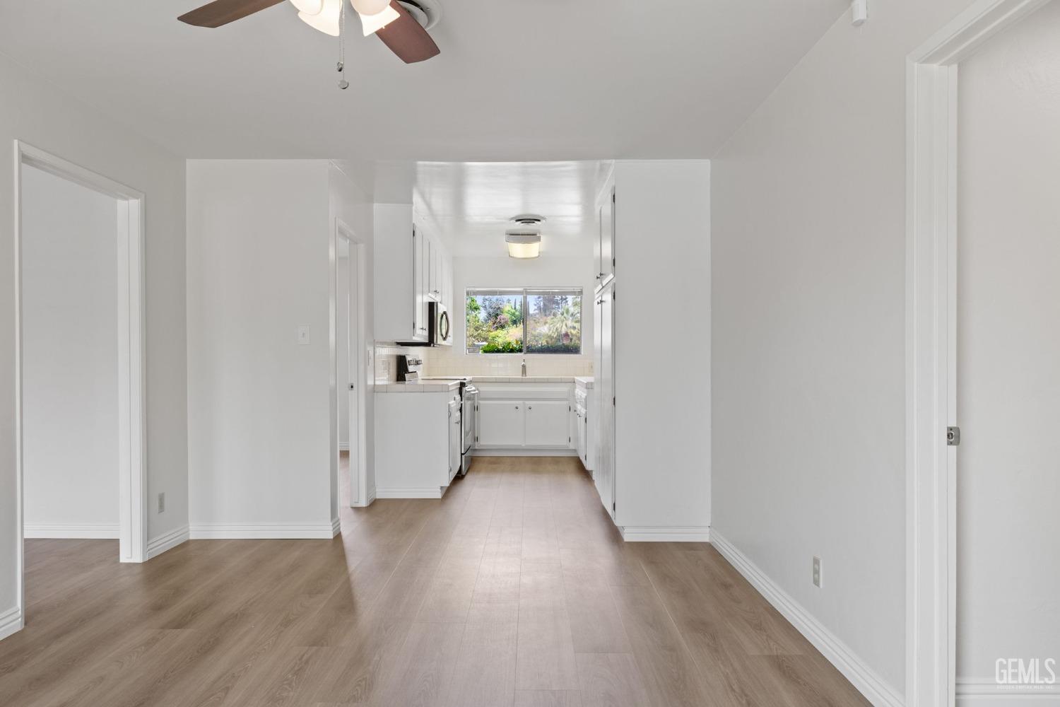 Undisclosed Address Bakersfield, CA 93306 - Photo 14 of 46 a kitchen with a sink and wooden floor