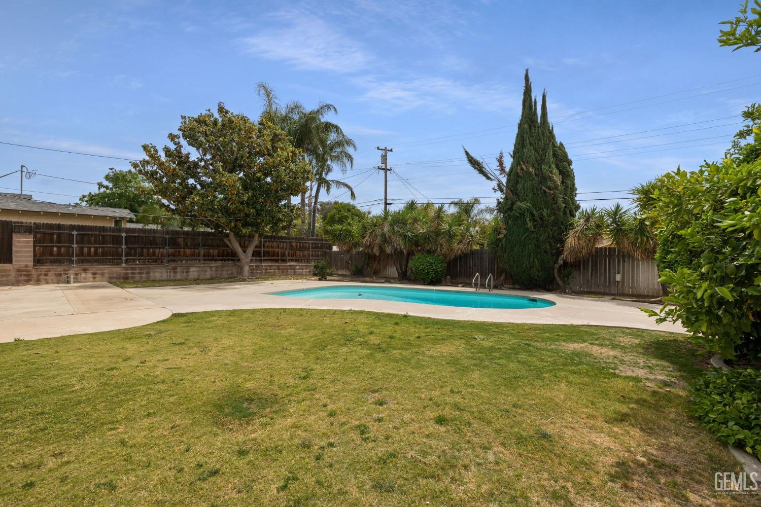 Undisclosed Address Bakersfield, CA 93306 - Photo 39 of 46 a view of a swimming pool with an outdoor space and seating area