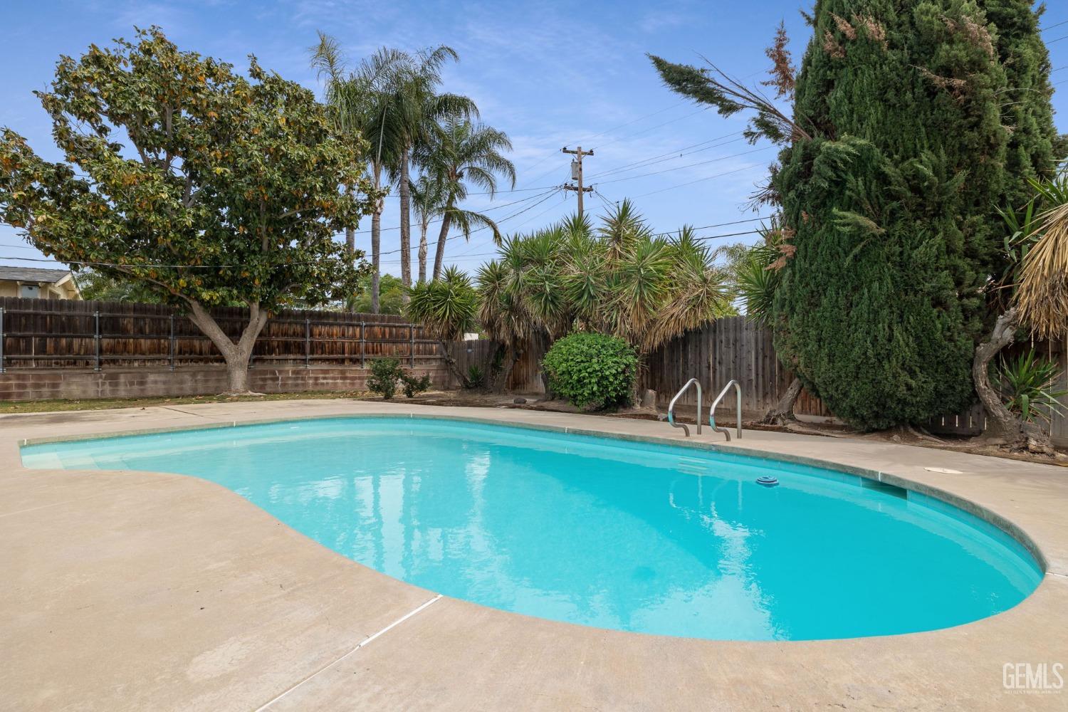 Undisclosed Address Bakersfield, CA 93306 - Photo 41 of 46 a view of a swimming pool with an outdoor space and seating area