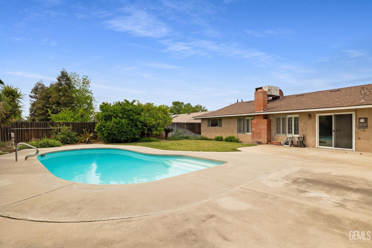 Undisclosed Address Bakersfield, CA 93306 - Photo 44 of 46 a front view of a house with swimming pool