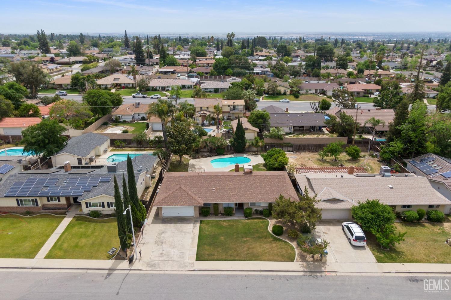 Undisclosed Address Bakersfield, CA 93306 - Photo 46 of 46 an aerial view of a house with a swimming pool and lake view