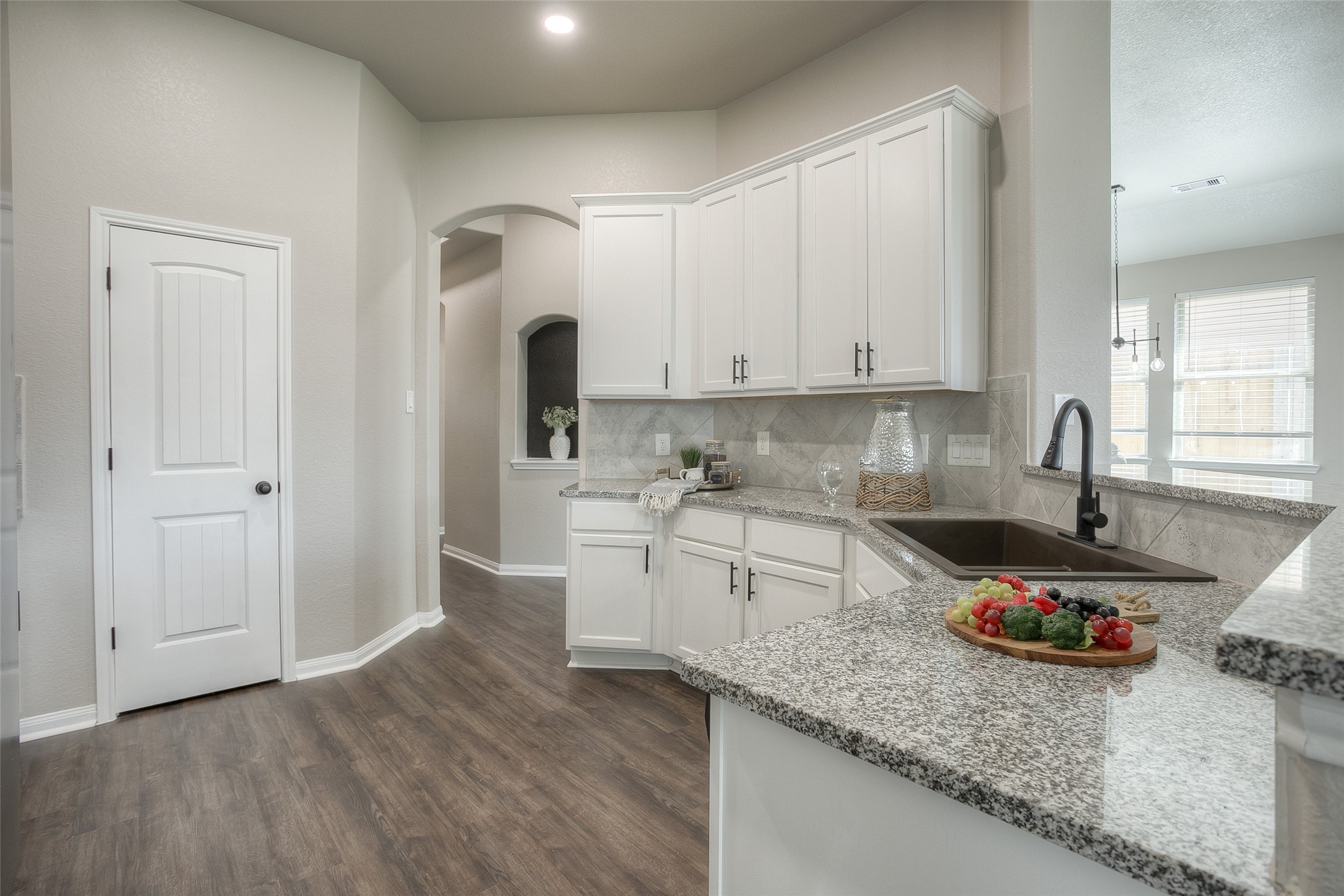 14519 Weir Creek Road Willis, TX 77318 - Photo 11 of 38 a kitchen with granite countertop a sink stainless steel appliances and cabinets