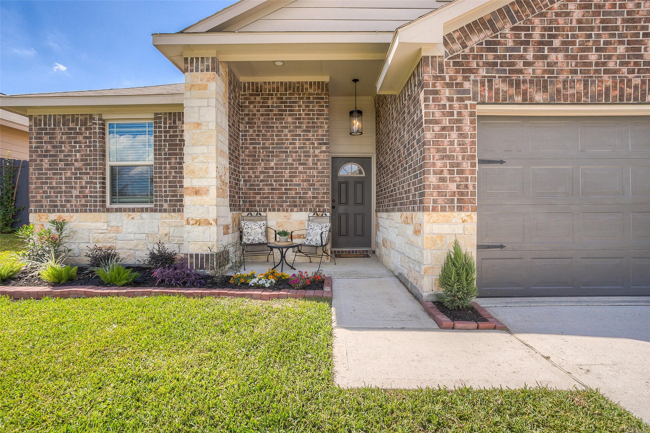 14519 Weir Creek Road Willis, TX 77318 - Photo 2 of 38 a front view of a house with a yard and potted plants