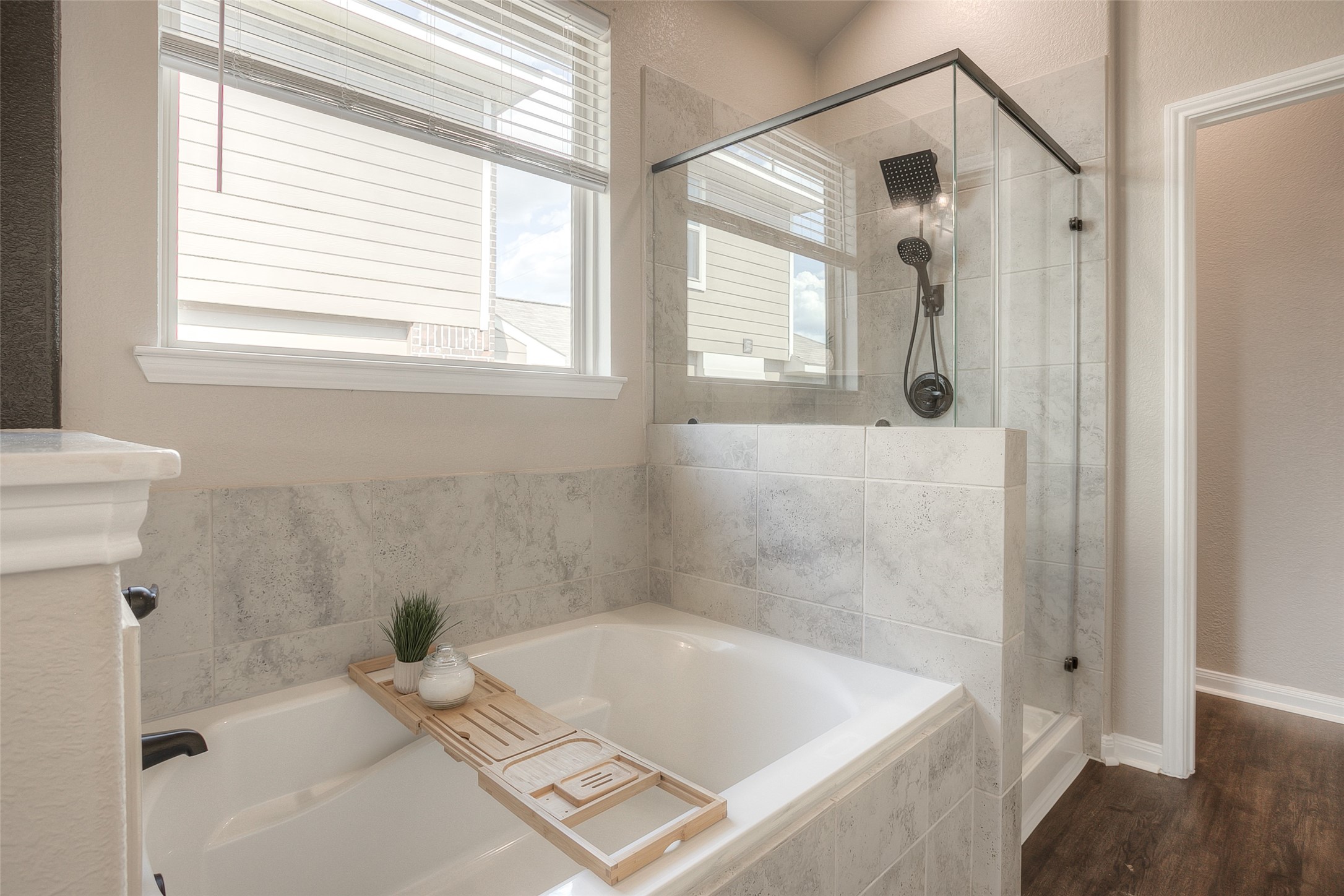 14519 Weir Creek Road Willis, TX 77318 - Photo 23 of 38 a bath tub sitting in a bathroom next to a window