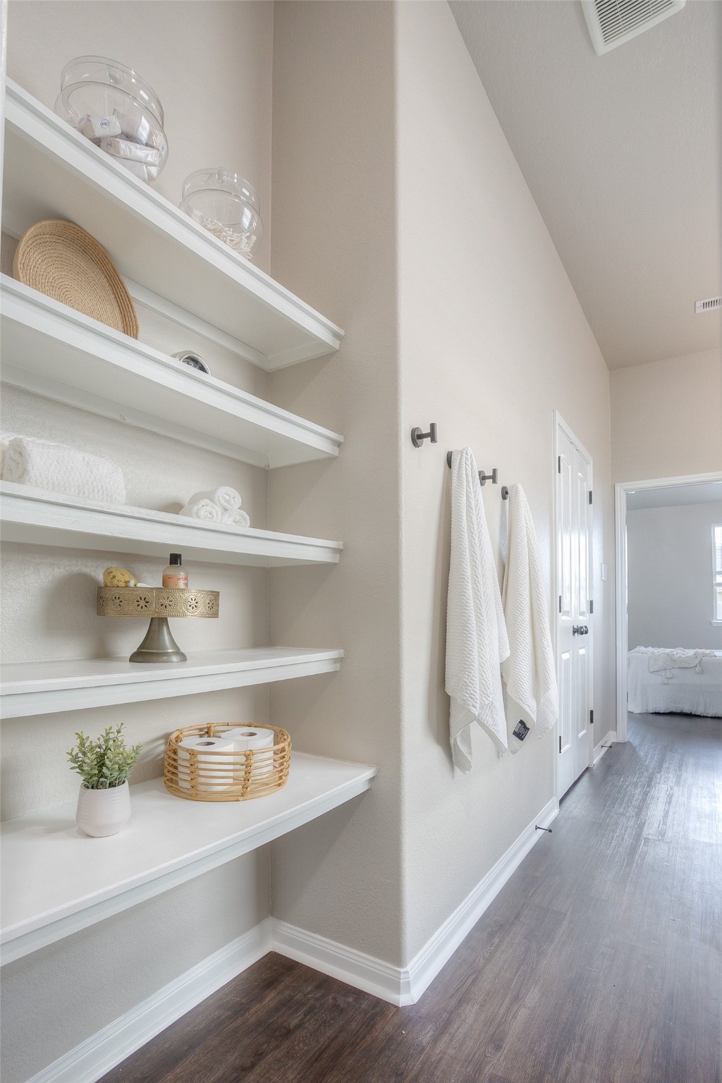 14519 Weir Creek Road Willis, TX 77318 - Photo 25 of 38 a view of walk in closet with empty racks