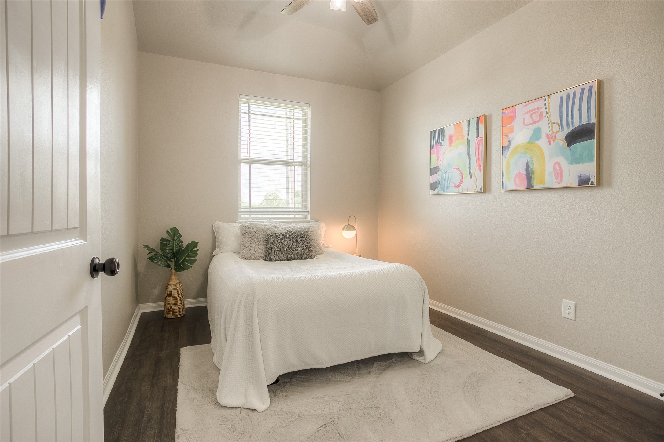 14519 Weir Creek Road Willis, TX 77318 - Photo 27 of 38 a bedroom with a bed and a painting on the wall