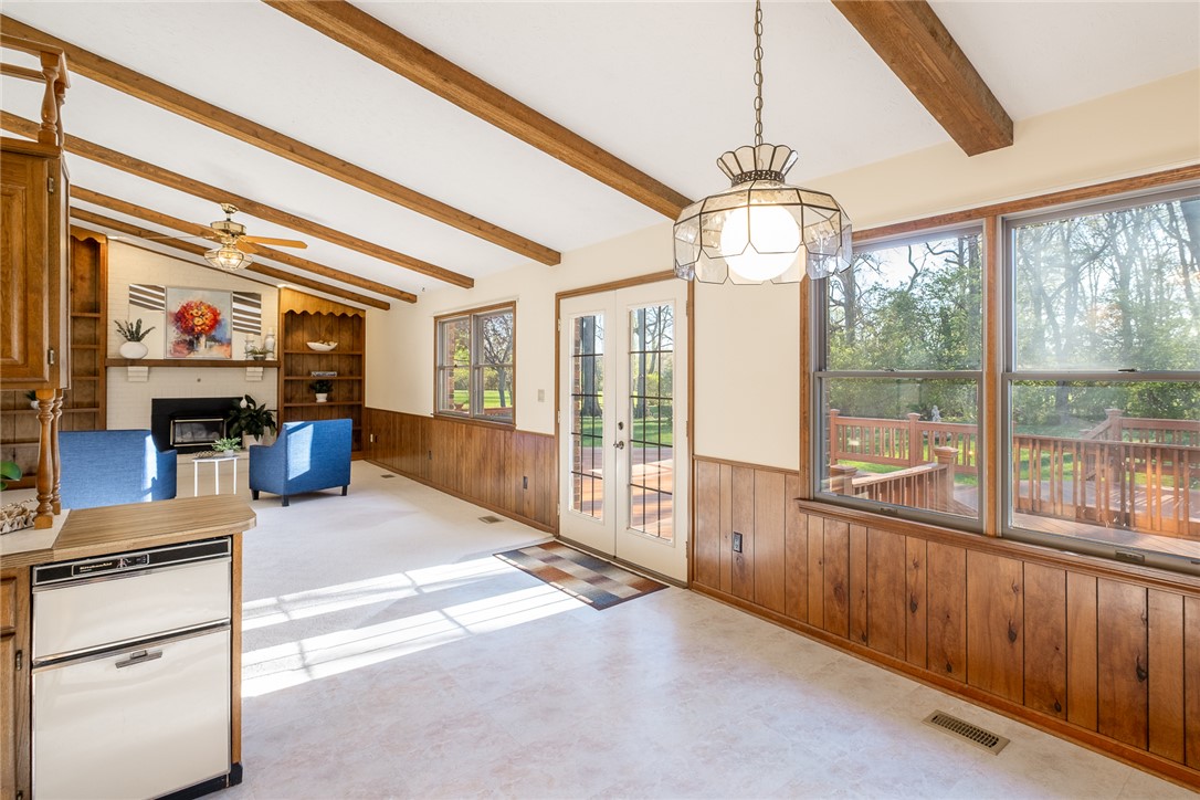 276 South Fairfield Road Bellbrook, OH 45305 - Photo 12 of 38 This inviting space features exposed beams and abundant natural light, offering comfort and charm.