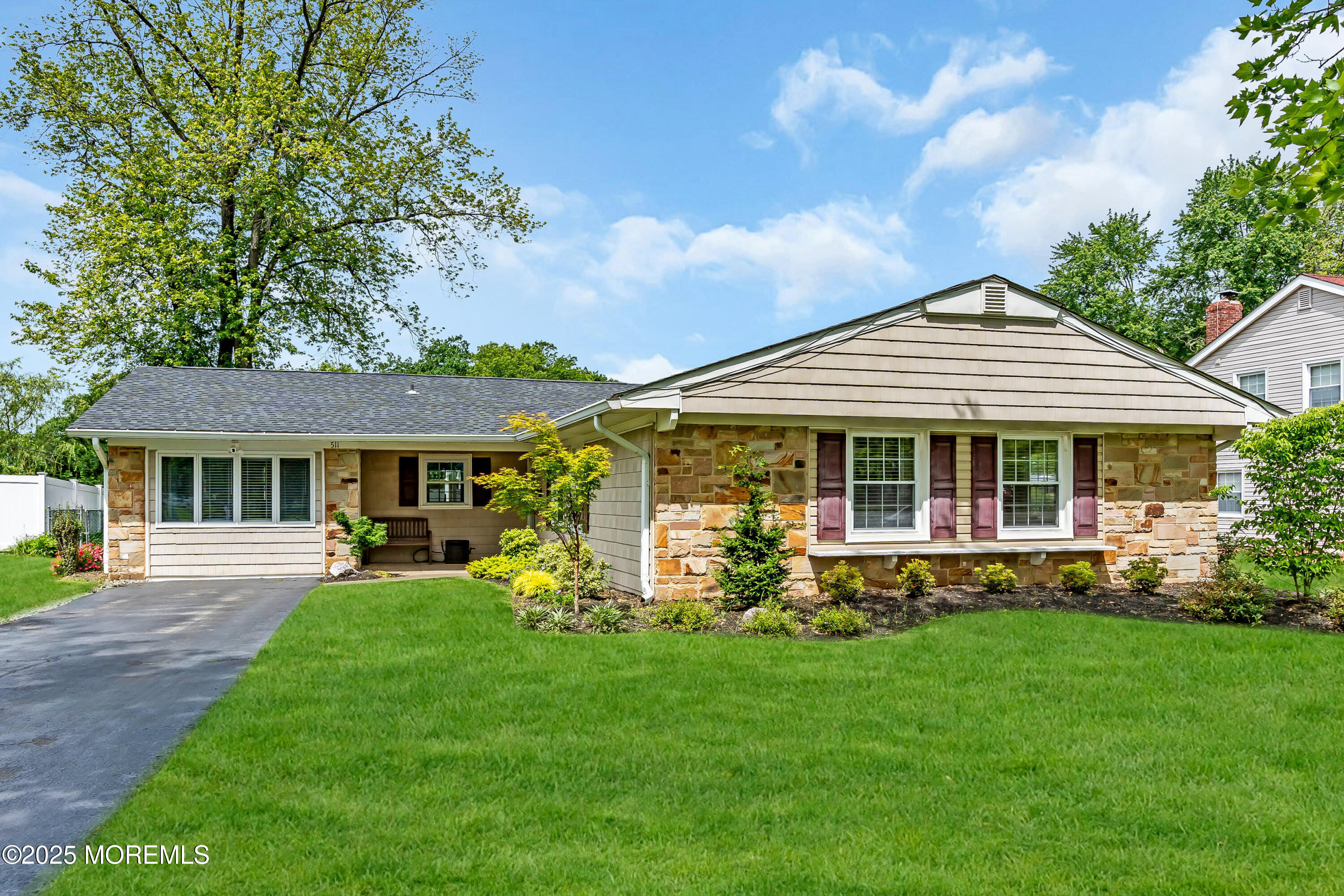 511 Line Road Aberdeen, NJ 07747 - Photo 1 of 53 a front view of a house with a yard table and chairs