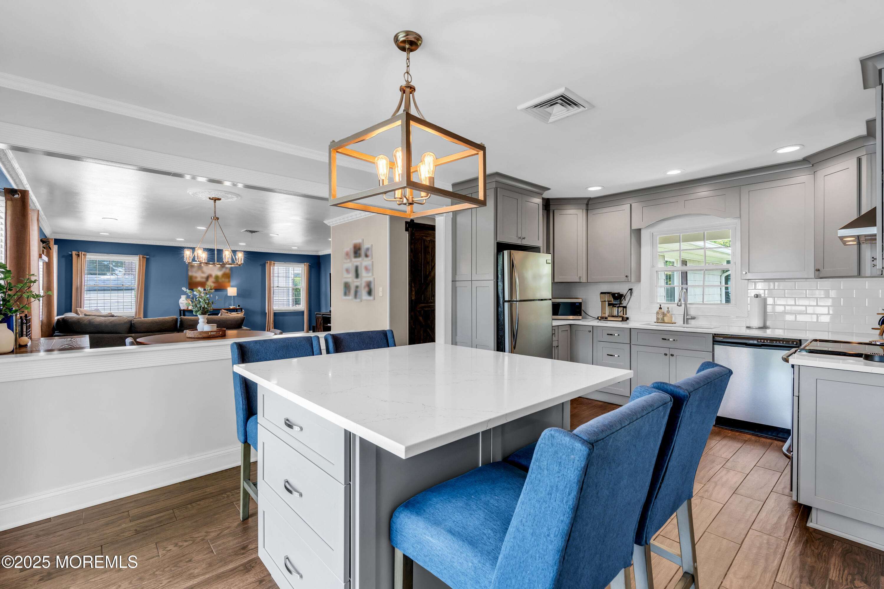 511 Line Road Aberdeen, NJ 07747 - Photo 14 of 53 a large kitchen with sink a refrigerator and chairs