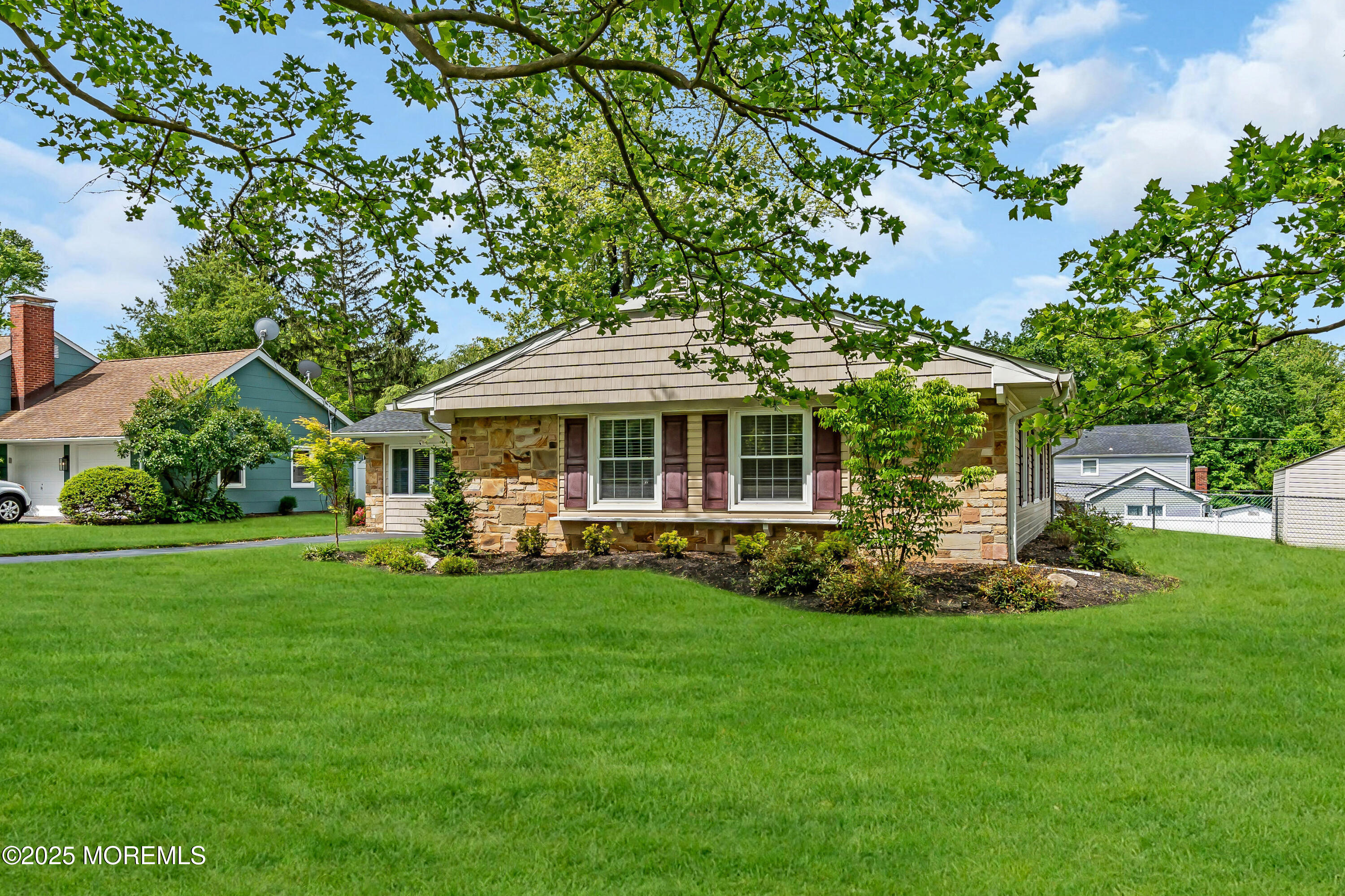 511 Line Road Aberdeen, NJ 07747 - Photo 2 of 53 a front view of a house with a garden