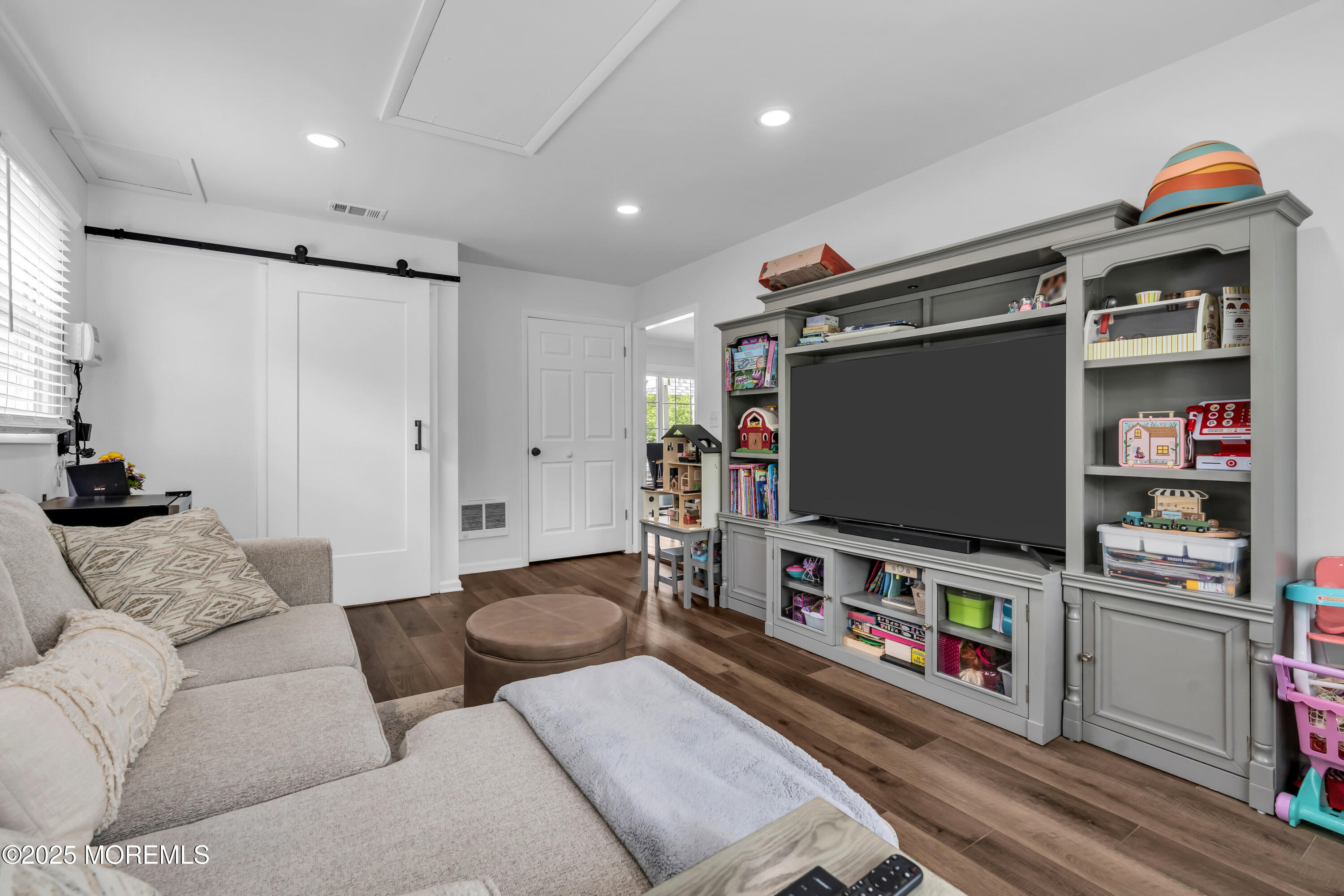 511 Line Road Aberdeen, NJ 07747 - Photo 21 of 53 a living room with furniture and a flat screen tv
