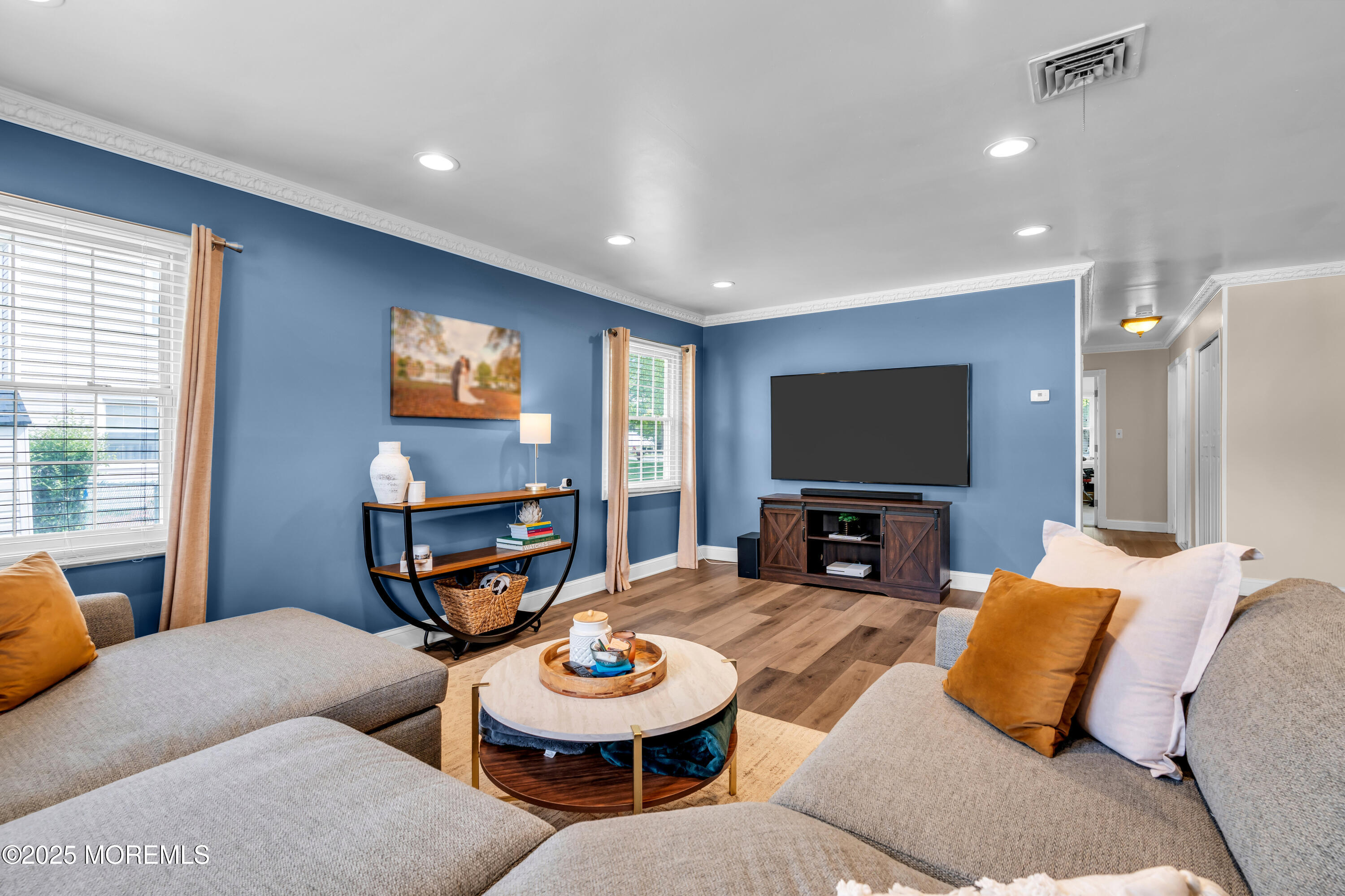 511 Line Road Aberdeen, NJ 07747 - Photo 27 of 53 a living room with furniture a projector and a flat screen tv