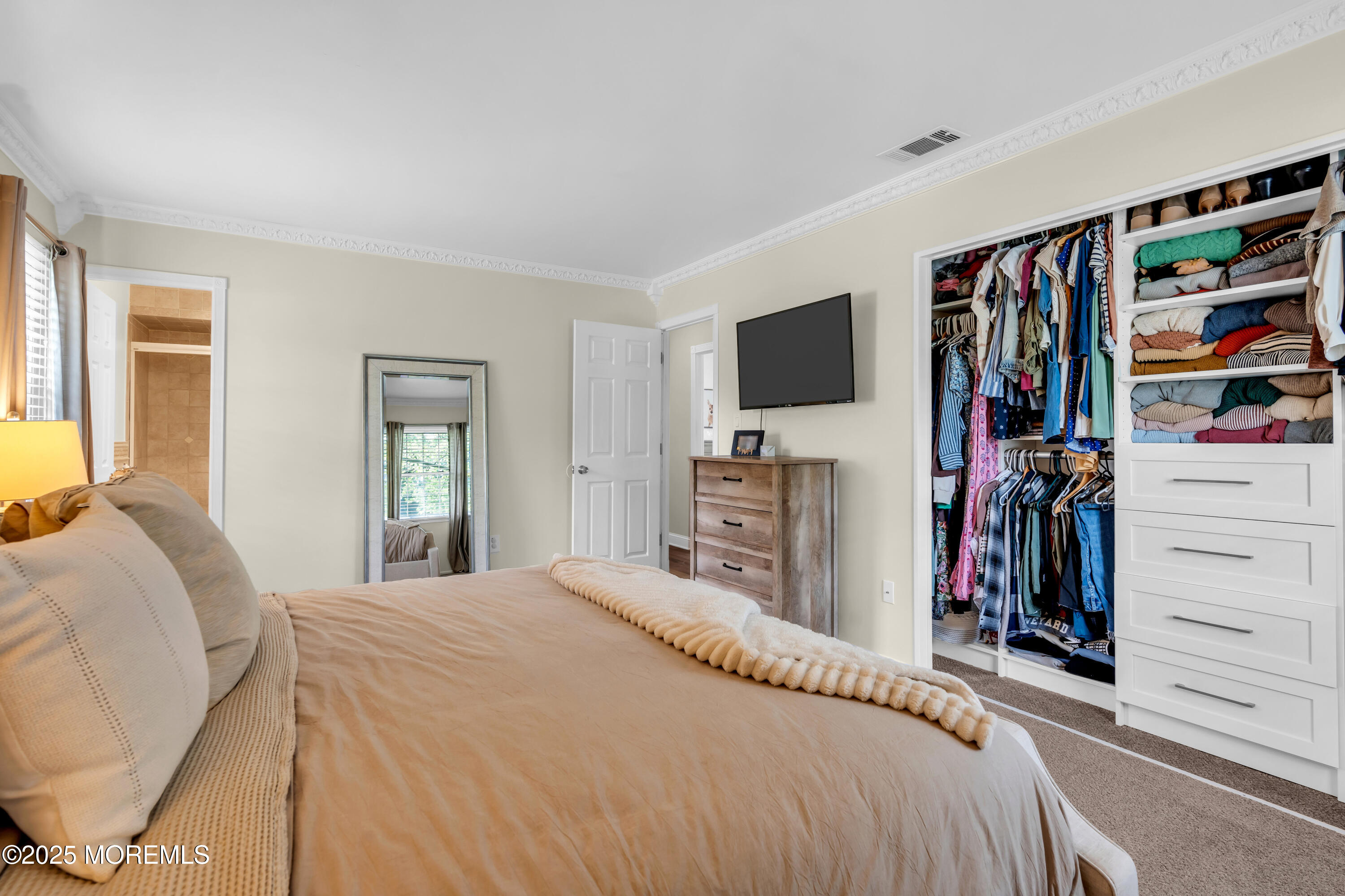 511 Line Road Aberdeen, NJ 07747 - Photo 32 of 53 a bedroom with a bed a flat screen tv and a window