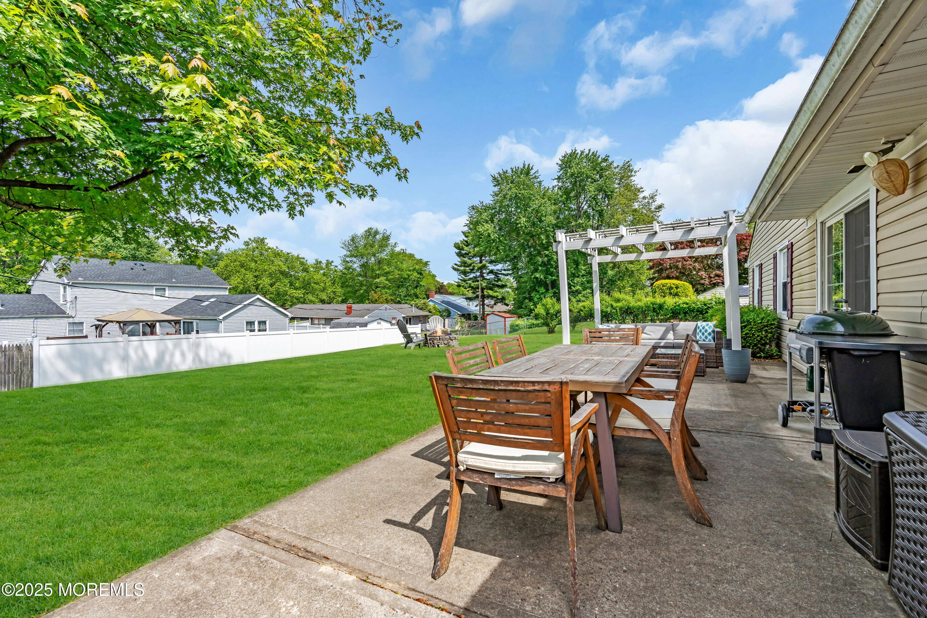 511 Line Road Aberdeen, NJ 07747 - Photo 37 of 53 a view of a patio with table and chairs and potted plants
