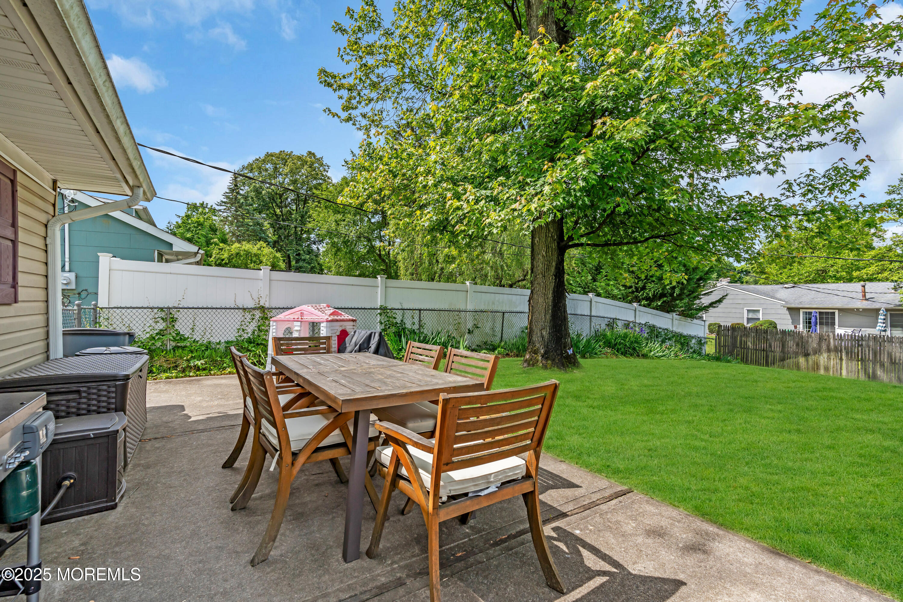 511 Line Road Aberdeen, NJ 07747 - Photo 38 of 53 a view of a dinning table and chairs in the patio