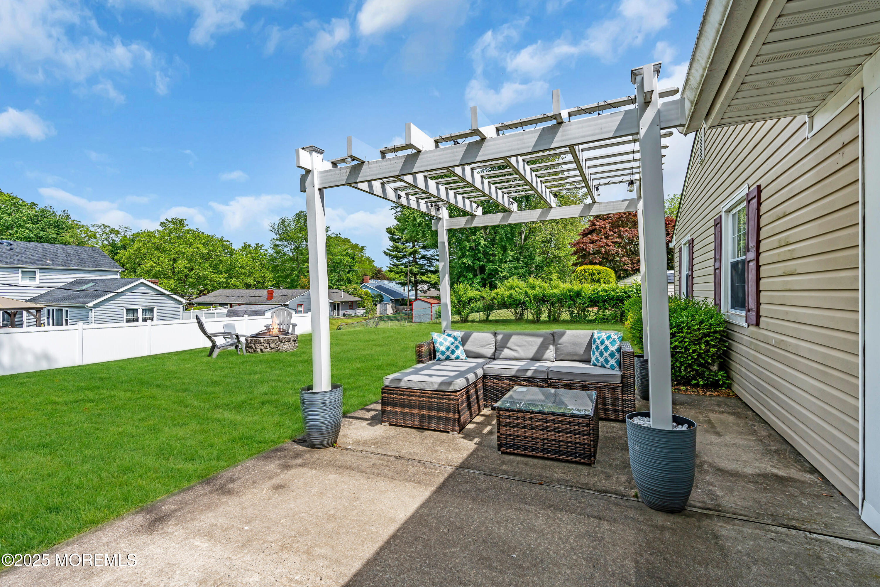 511 Line Road Aberdeen, NJ 07747 - Photo 39 of 53 a view of a patio with couches chairs potted plants and floor to ceiling window