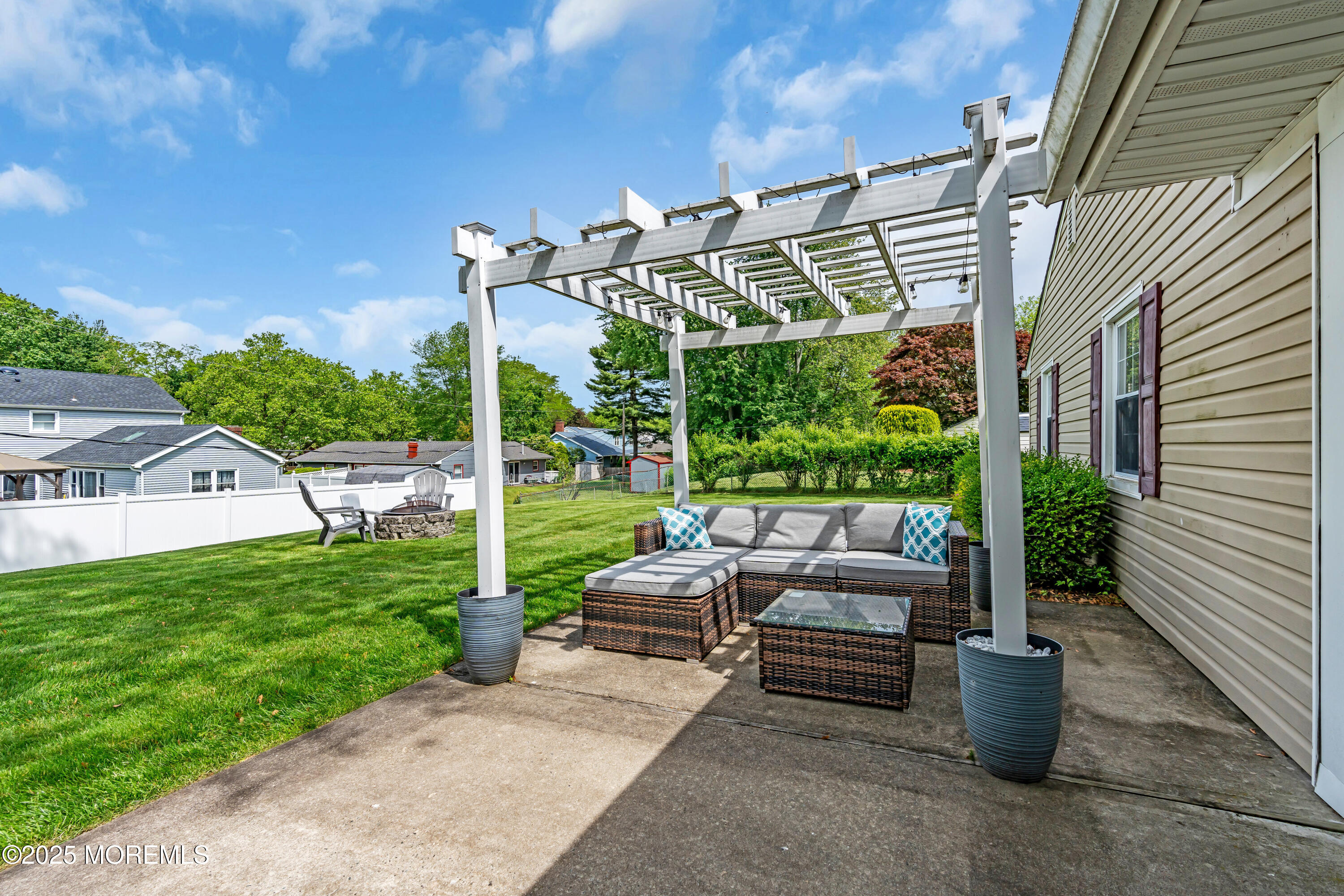 511 Line Road Aberdeen, NJ 07747 - Photo 46 of 53 a view of a patio with couches chairs potted plants and floor to ceiling window