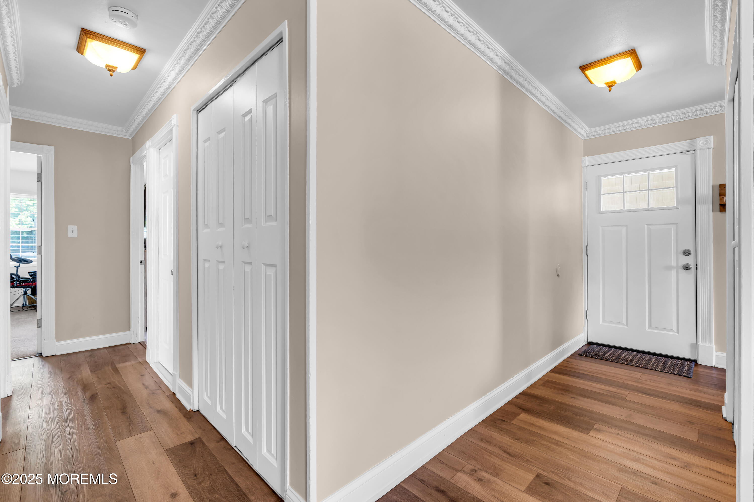 511 Line Road Aberdeen, NJ 07747 - Photo 8 of 53 a view of a hallway with wooden floor and stairs
