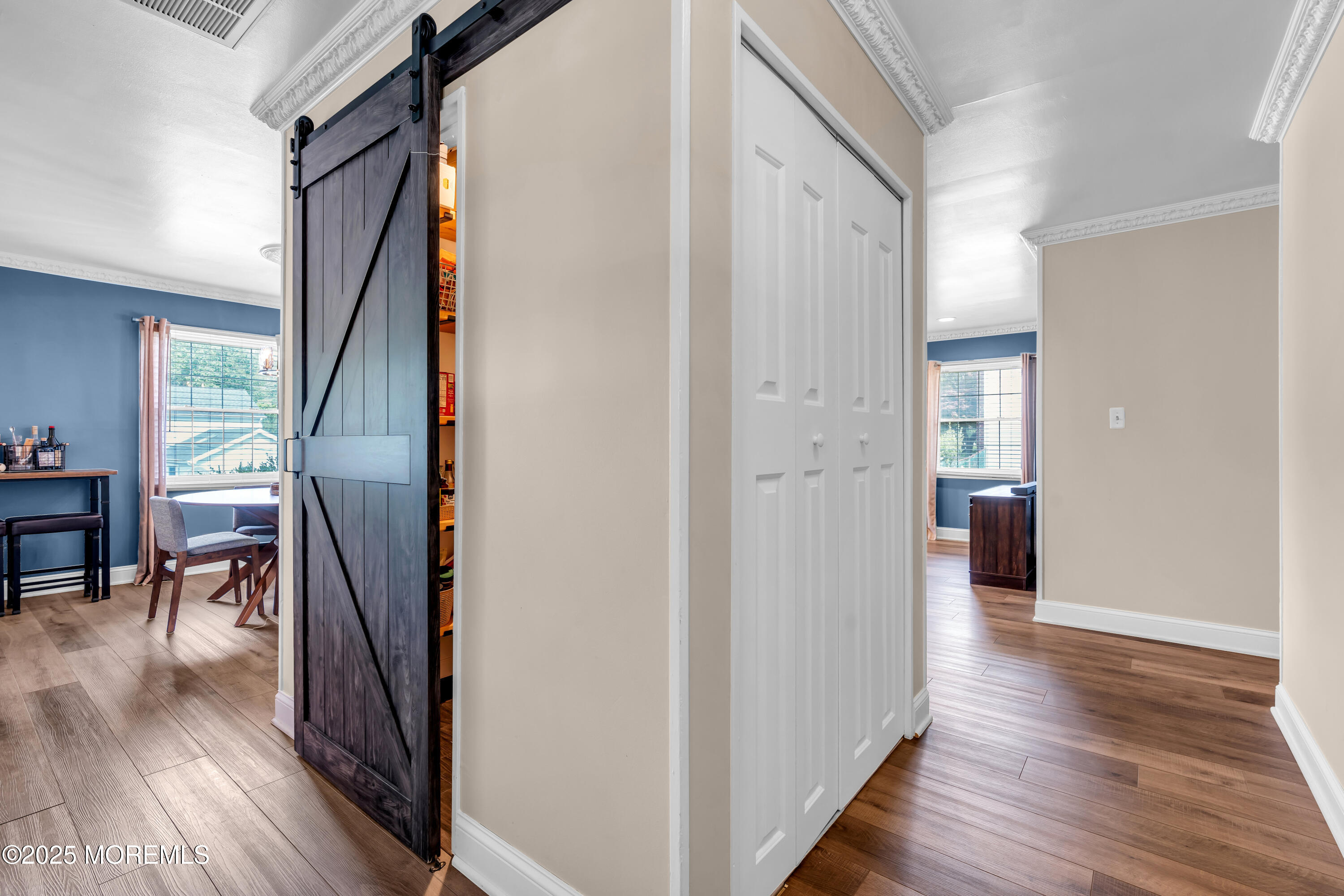 511 Line Road Aberdeen, NJ 07747 - Photo 9 of 53 a view of a hallway with wooden floor and furniture