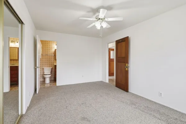 a view of an empty room with glass door