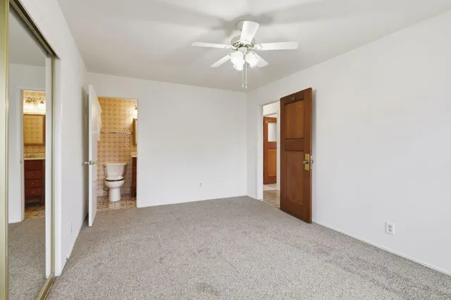 a view of an empty room with glass door