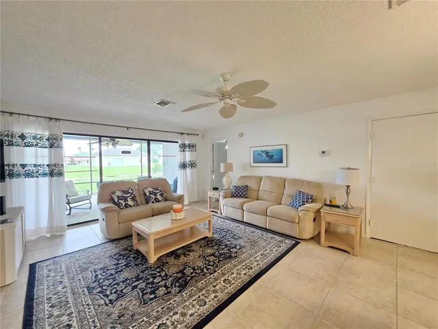 a living room with furniture and a rug