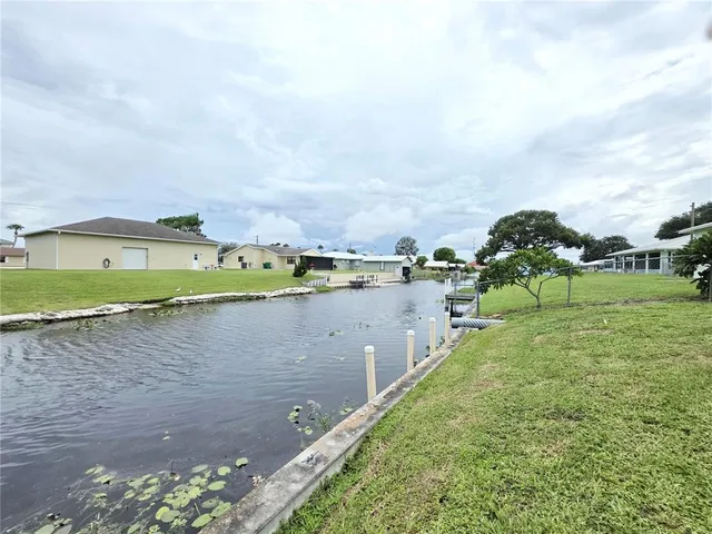 a view of a lake with a large building in the back