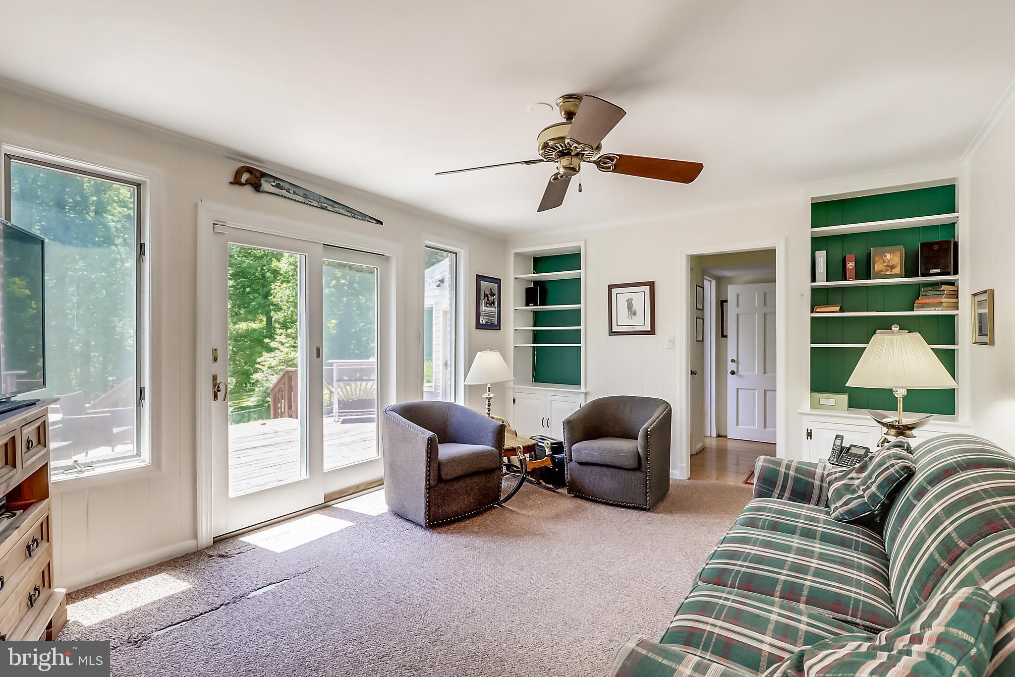 10740 River Road Potomac, MD 20854 - Photo 18 of 64 Family room built in book shelves & SGD to deck