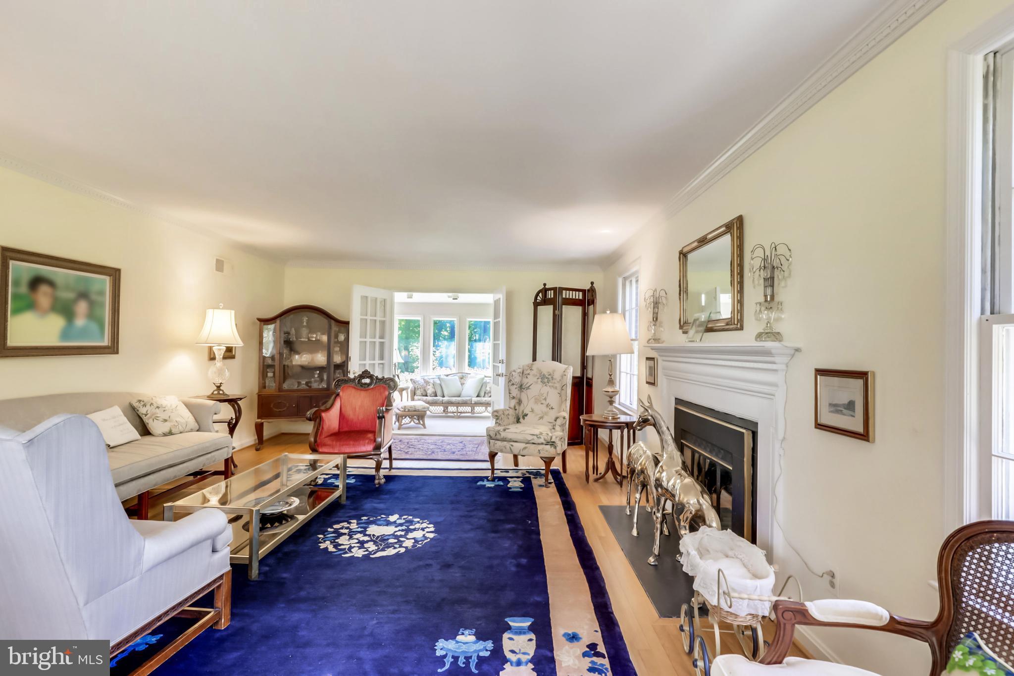 10740 River Road Potomac, MD 20854 - Photo 6 of 64 Stunning front to back LR with sunroom addition