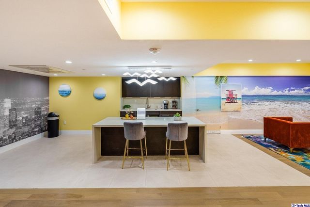 a living room with furniture and a pool