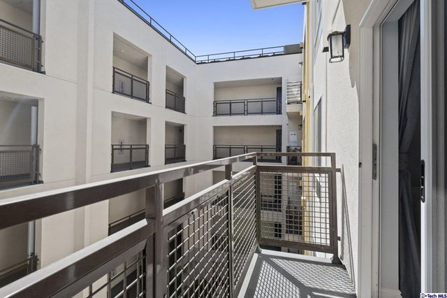 a dining room with furniture and chandelier