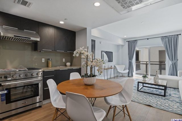 a kitchen with a sink and a refrigerator