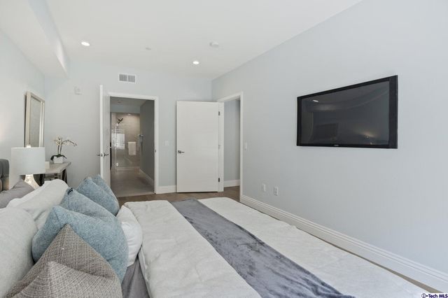 a view of a kitchen with a refrigerator