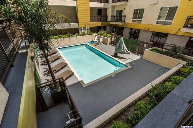 a view of a backyard with sitting area