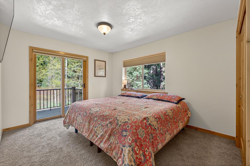 31 Eagle Trail Cascade, ID 83611 - Photo 29 of 50 One of two upstairs guest rooms that both access the shared balcony.