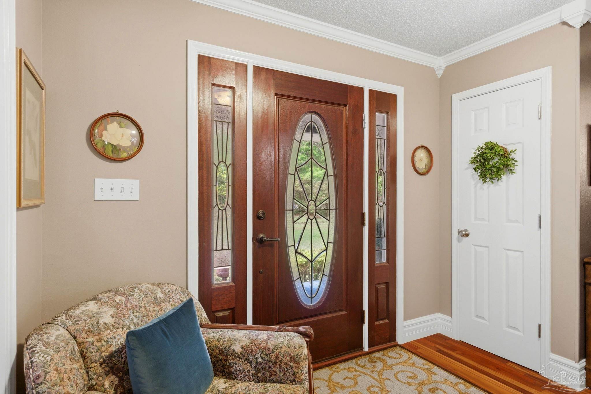 6930 Summit Way Milton, FL 32570 - Photo 4 of 71 a bedroom with a bed and a window