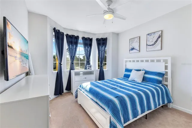a bathroom with a granite countertop sink mirror vanity and toilet