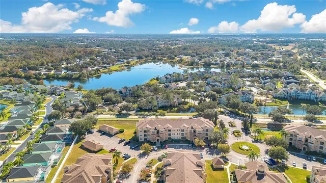 an aerial view of residential building and lake view