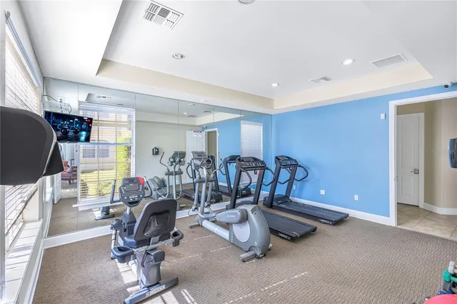 a living room with furniture a table and a clock