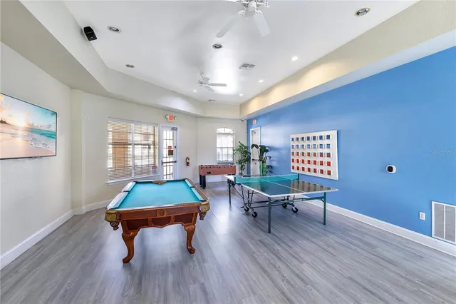 a living room with furniture a window and gym equipment