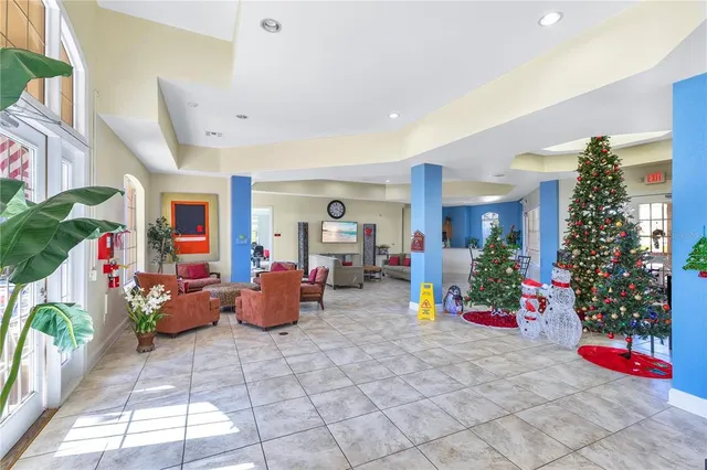 a dining room with furniture and potted plants